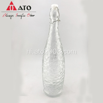 बकसुआ ढक्कन के साथ स्पष्ट कांच की पानी की बोतल